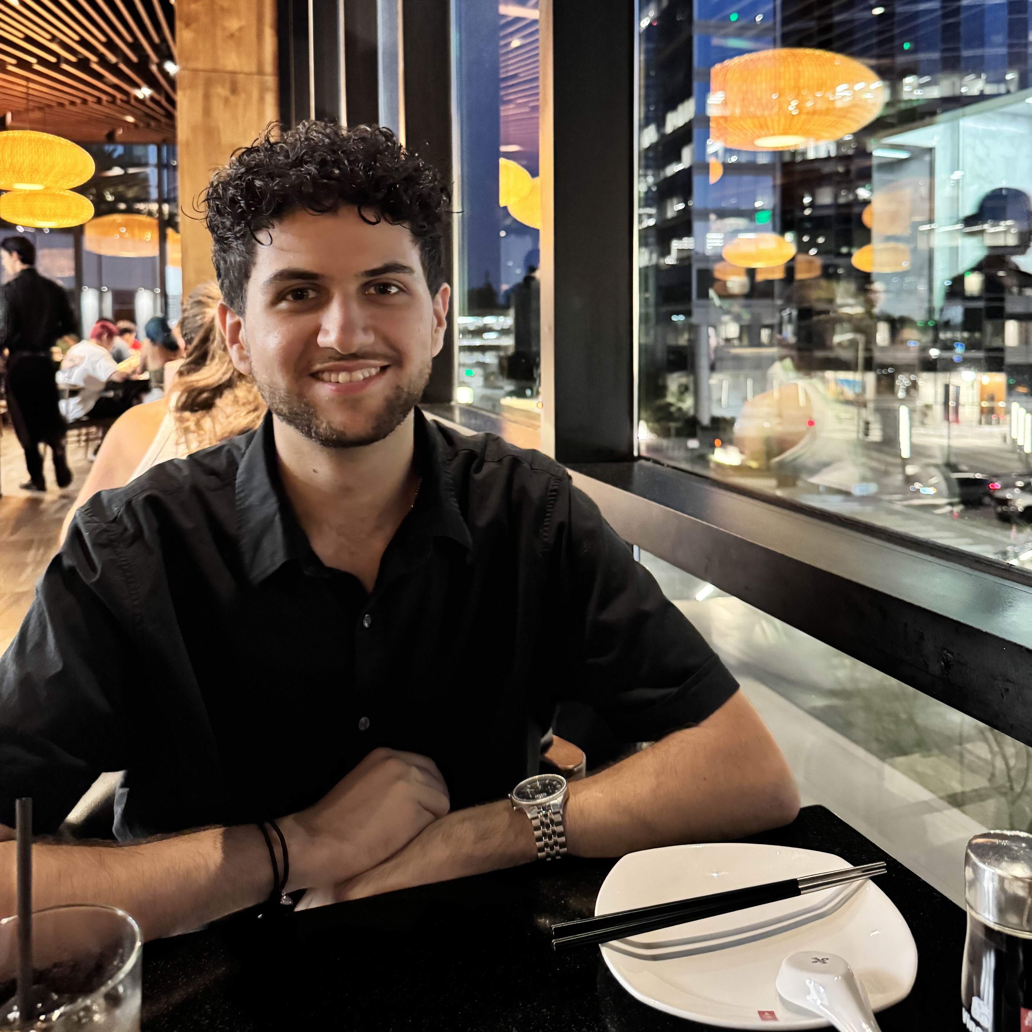 Portrait of Arian Vahdat smiling